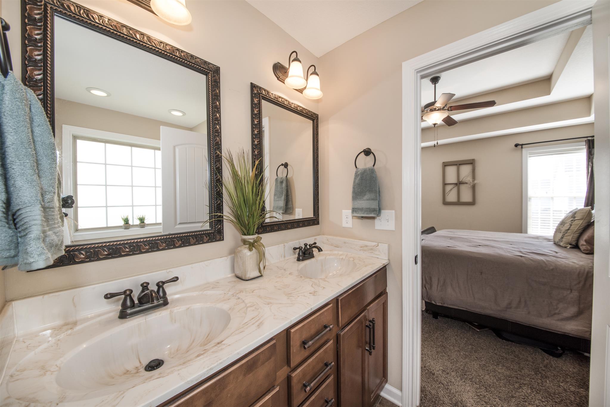3775 Suiter Road Clarksville, TN 37040 - Photo 5 of 29 a bathroom with a double vanity sink mirror and