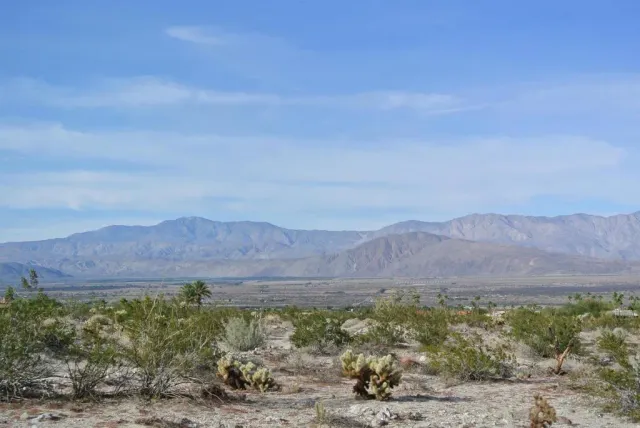 a view of mountains and valleys