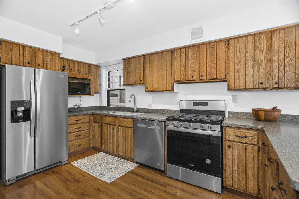 Undisclosed Address Evanston, IL 60201 - Photo 15 of 39 a kitchen with a stove a sink and a refrigerator