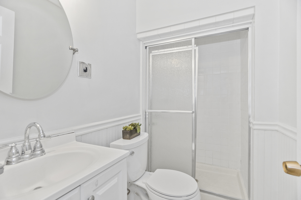 Undisclosed Address Evanston, IL 60201 - Photo 18 of 39 a white toilet sitting next to a bathroom sink