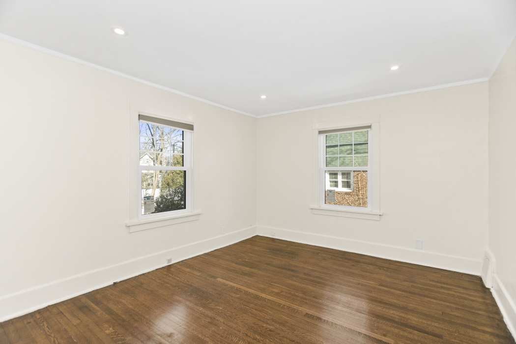 Undisclosed Address Evanston, IL 60201 - Photo 19 of 39 an empty room with wooden floor and windows