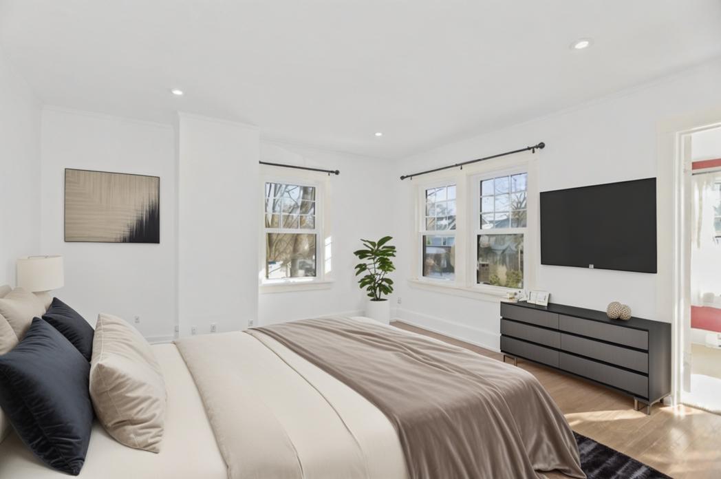 Undisclosed Address Evanston, IL 60201 - Photo 21 of 39 a bedroom with a bed and a flat screen tv