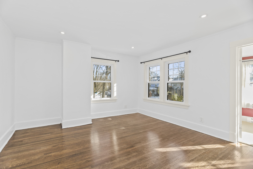 Undisclosed Address Evanston, IL 60201 - Photo 22 of 39 an empty room with wooden floor and windows