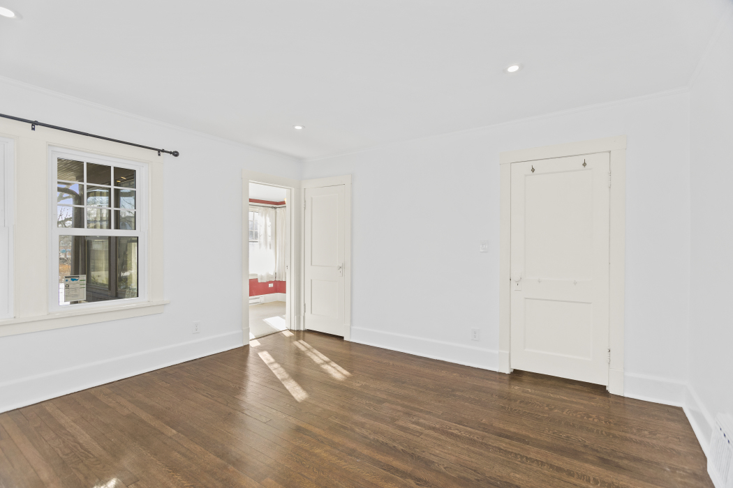 Undisclosed Address Evanston, IL 60201 - Photo 23 of 39 an empty room with wooden floor and windows