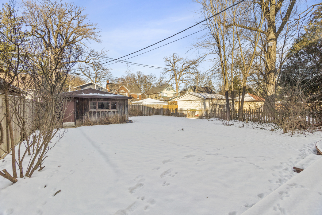 Undisclosed Address Evanston, IL 60201 - Photo 33 of 39 a view of a house with a snow in the yard