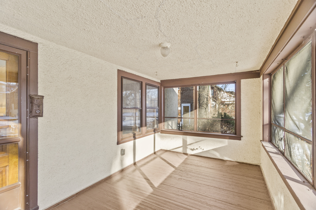Undisclosed Address Evanston, IL 60201 - Photo 5 of 39 a view of a city from a big room with wooden floor and windows