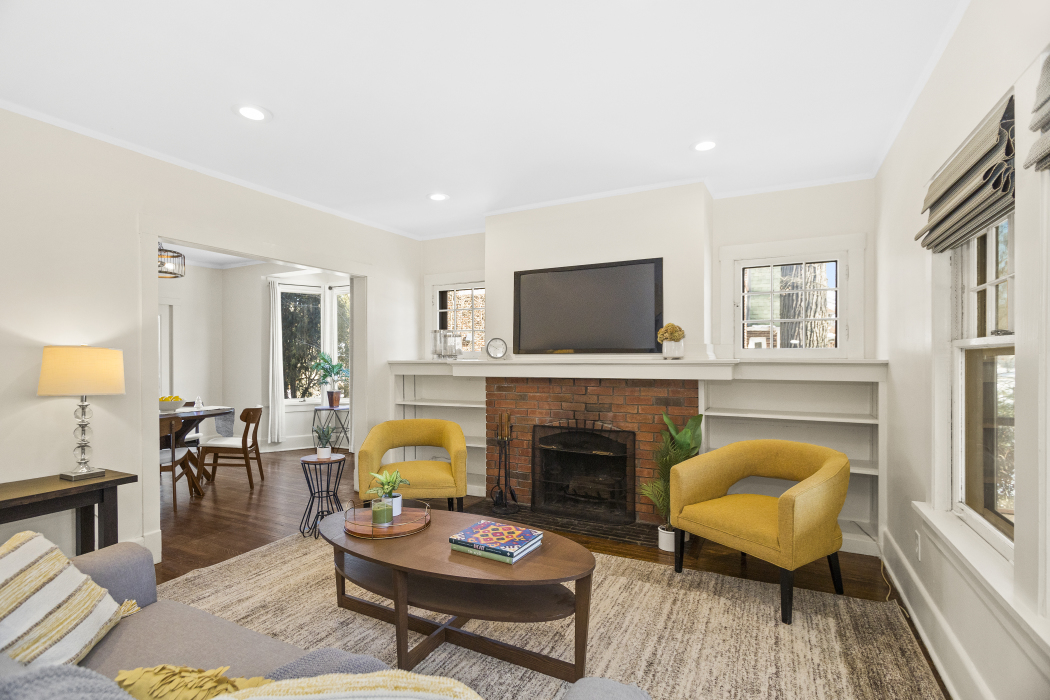 Undisclosed Address Evanston, IL 60201 - Photo 10 of 39 a living room with furniture a fireplace and a flat screen tv