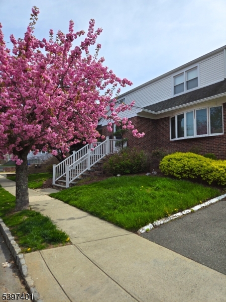 50 Newark Place, Unit 2 Belleville, NJ 07109 - Photo 21 of 21 a front view of a house with garden