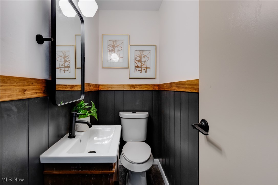 3691 Lyntz Road Warren, OH 44481 - Photo 13 of 36 Bathroom with vanity and a wainscoted wall