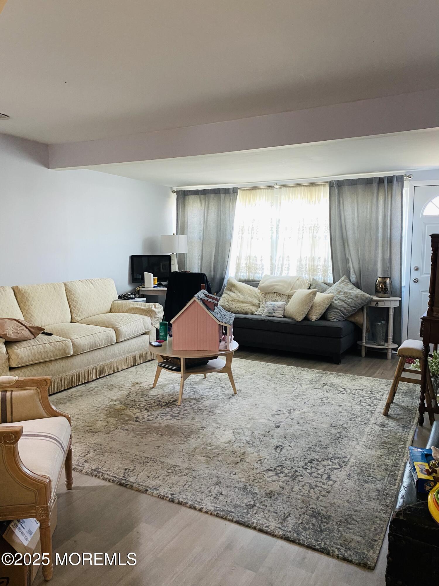 439 Mantoloking Road Brick, NJ 08723 - Photo 11 of 19 a living room with furniture wooden floor and window