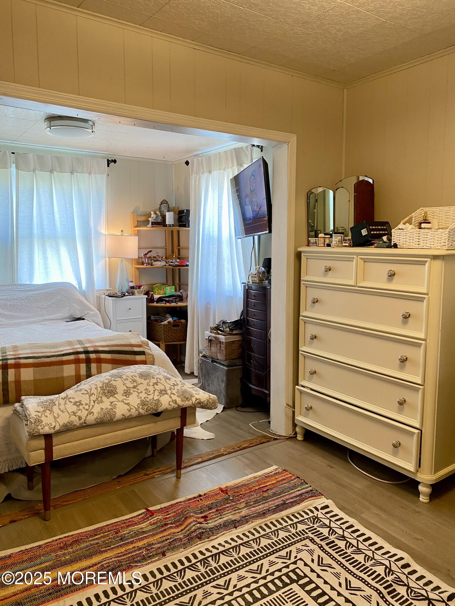 439 Mantoloking Road Brick, NJ 08723 - Photo 13 of 19 a bedroom with a bed and a walk in closet