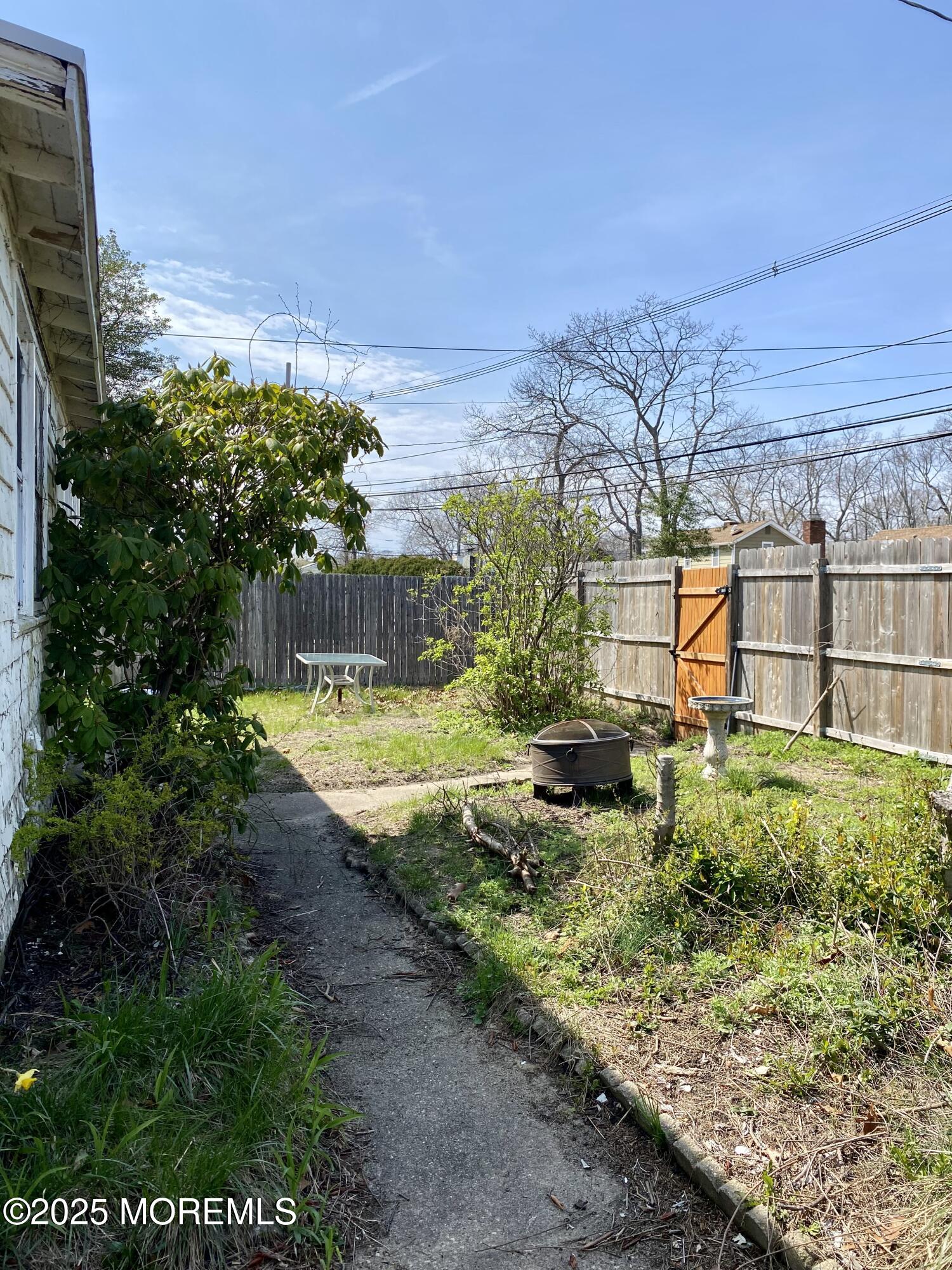 439 Mantoloking Road Brick, NJ 08723 - Photo 19 of 19 a view of a garden with a building in the background