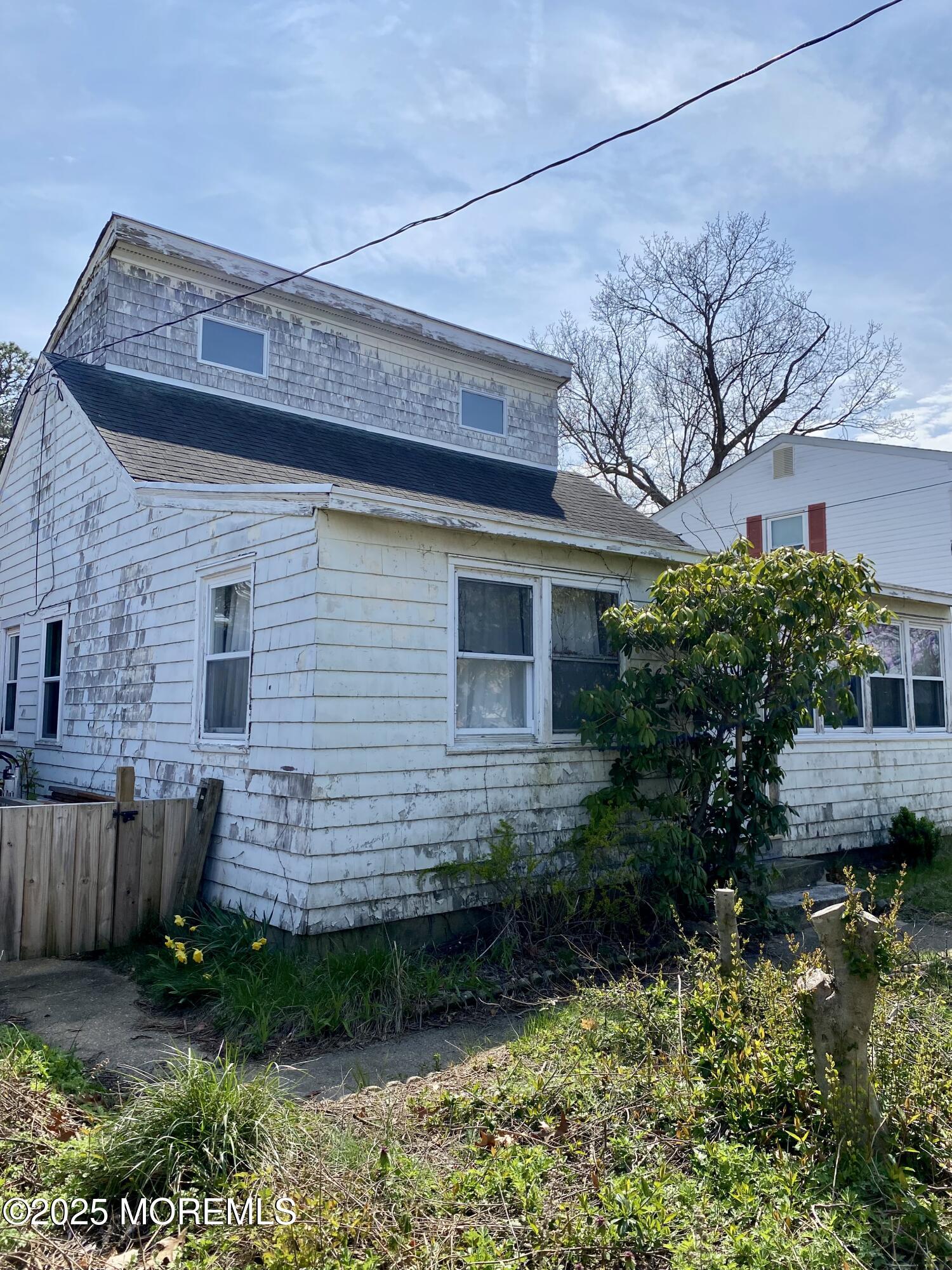 439 Mantoloking Road Brick, NJ 08723 - Photo 3 of 19 a view of a house with a yard and plants