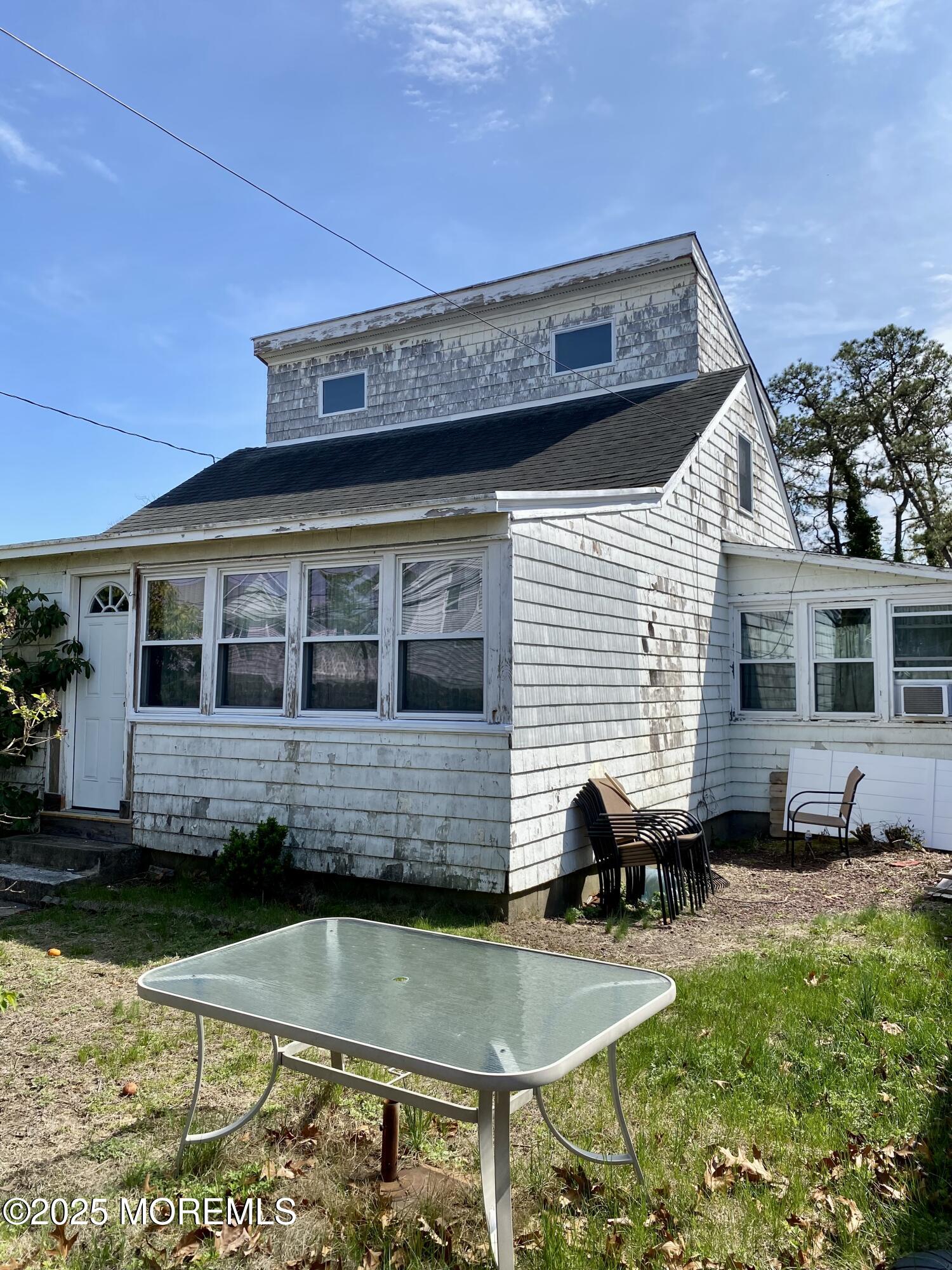 439 Mantoloking Road Brick, NJ 08723 - Photo 4 of 19 a view of house with swimming pool and sitting area