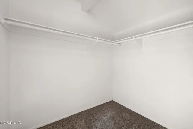 a view of a room with shelf on the wall