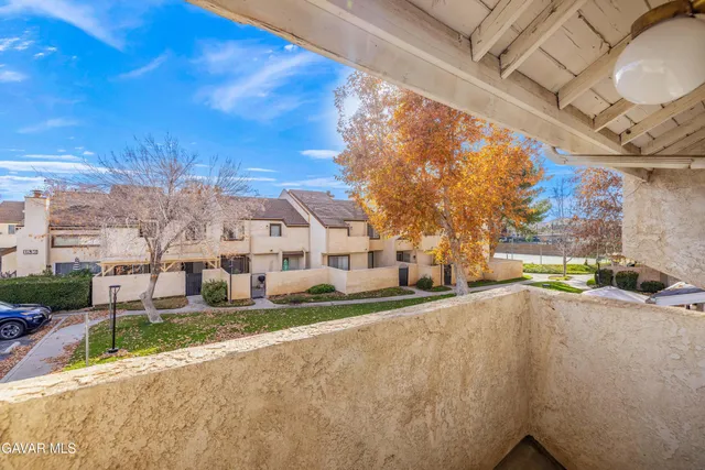 a view of a street with a building in the background