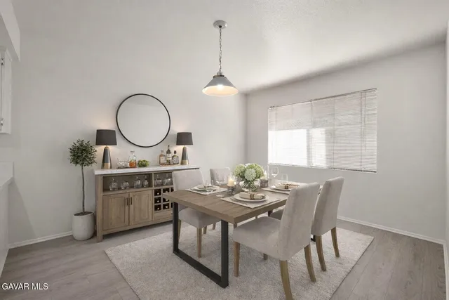 a dining room with a sink and chairs