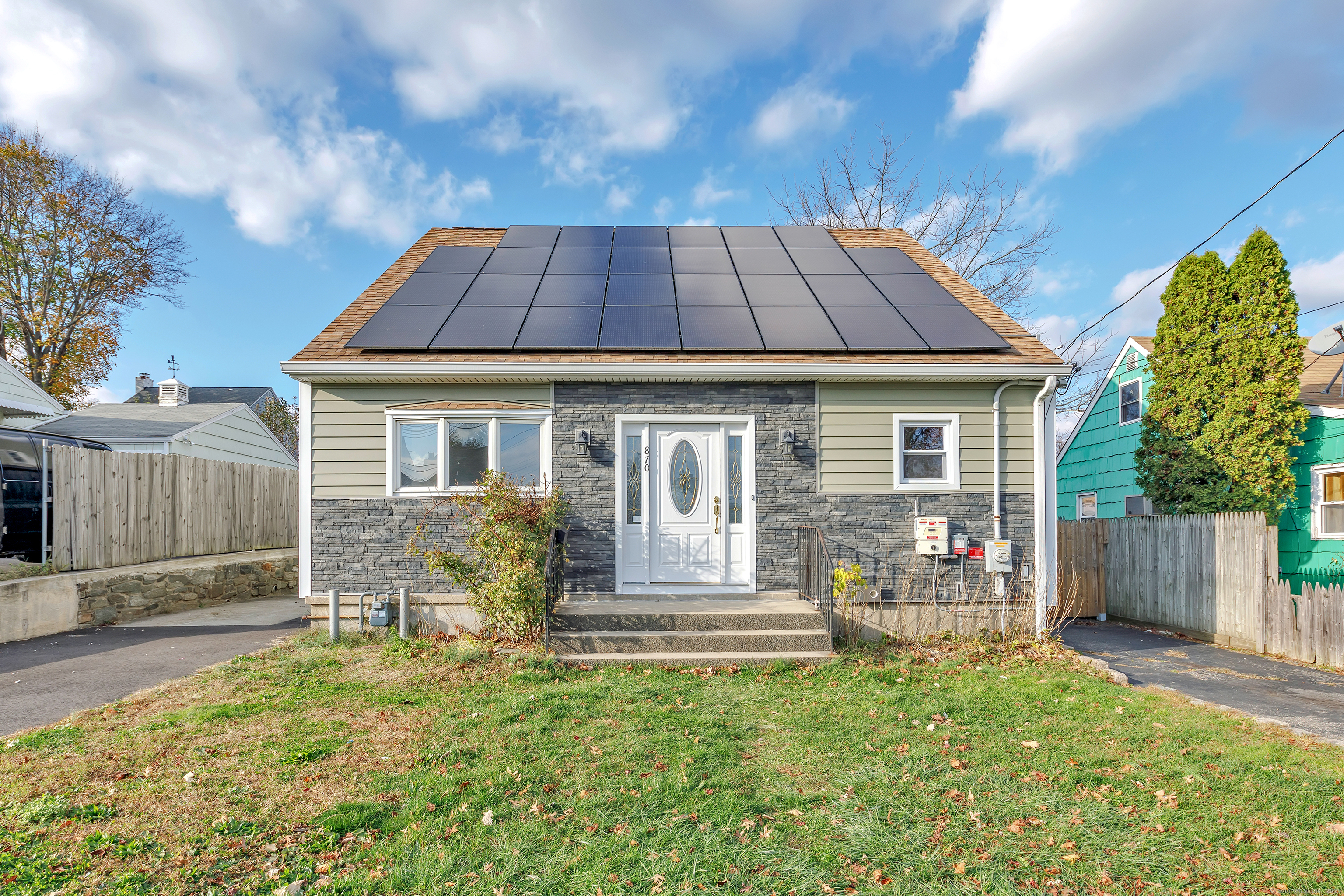 a front view of a house with a yard