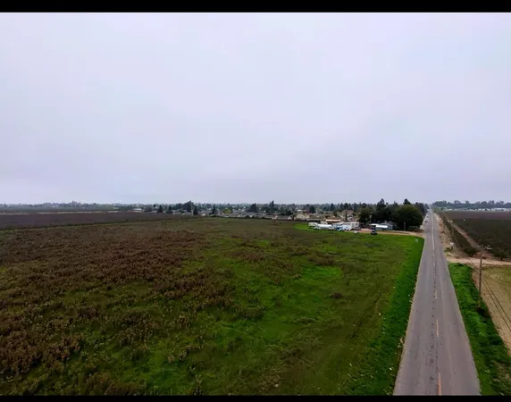 a view of a lake with a yard