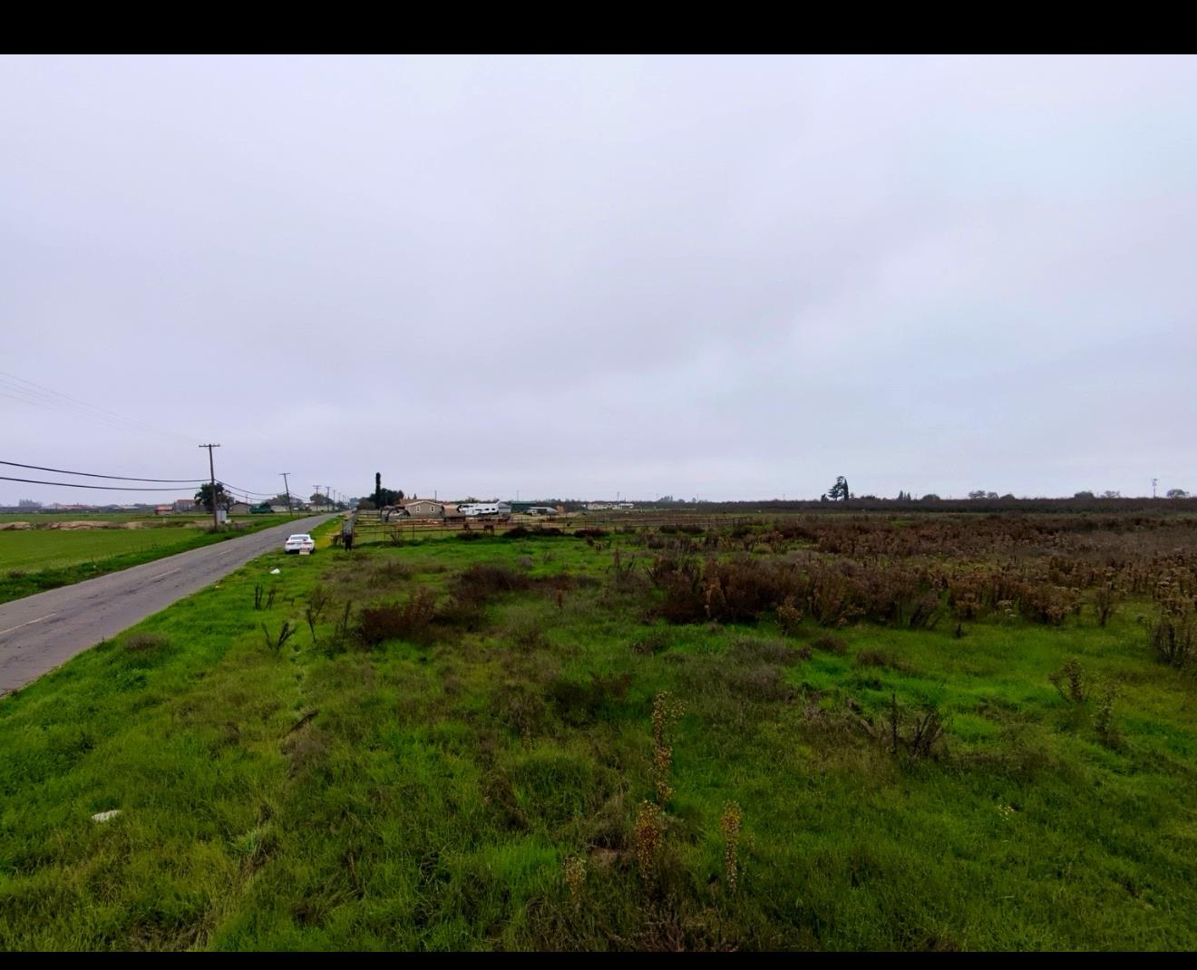 10310 Merced Avenue Delhi, CA 95315 - Photo 5 of 7 a view of a lush green outdoor space with a swimming pool
