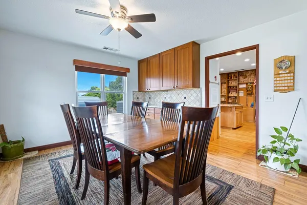 a view of a dining room with furniture window and wooden floor