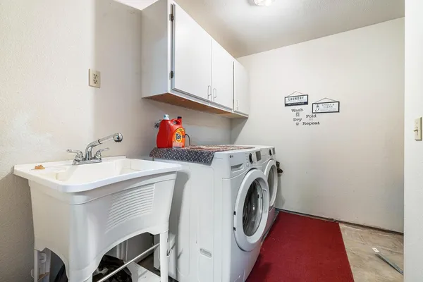 a bathroom with a sink toilet and a mirror