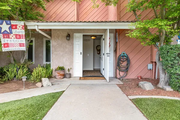a front view of a house with garden