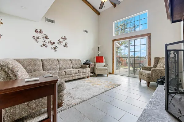 a living room with furniture and a couch