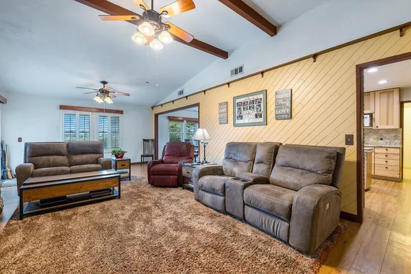 a living room with furniture and a rug