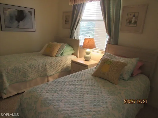 a bathroom with a sink a toilet a mirror and shower