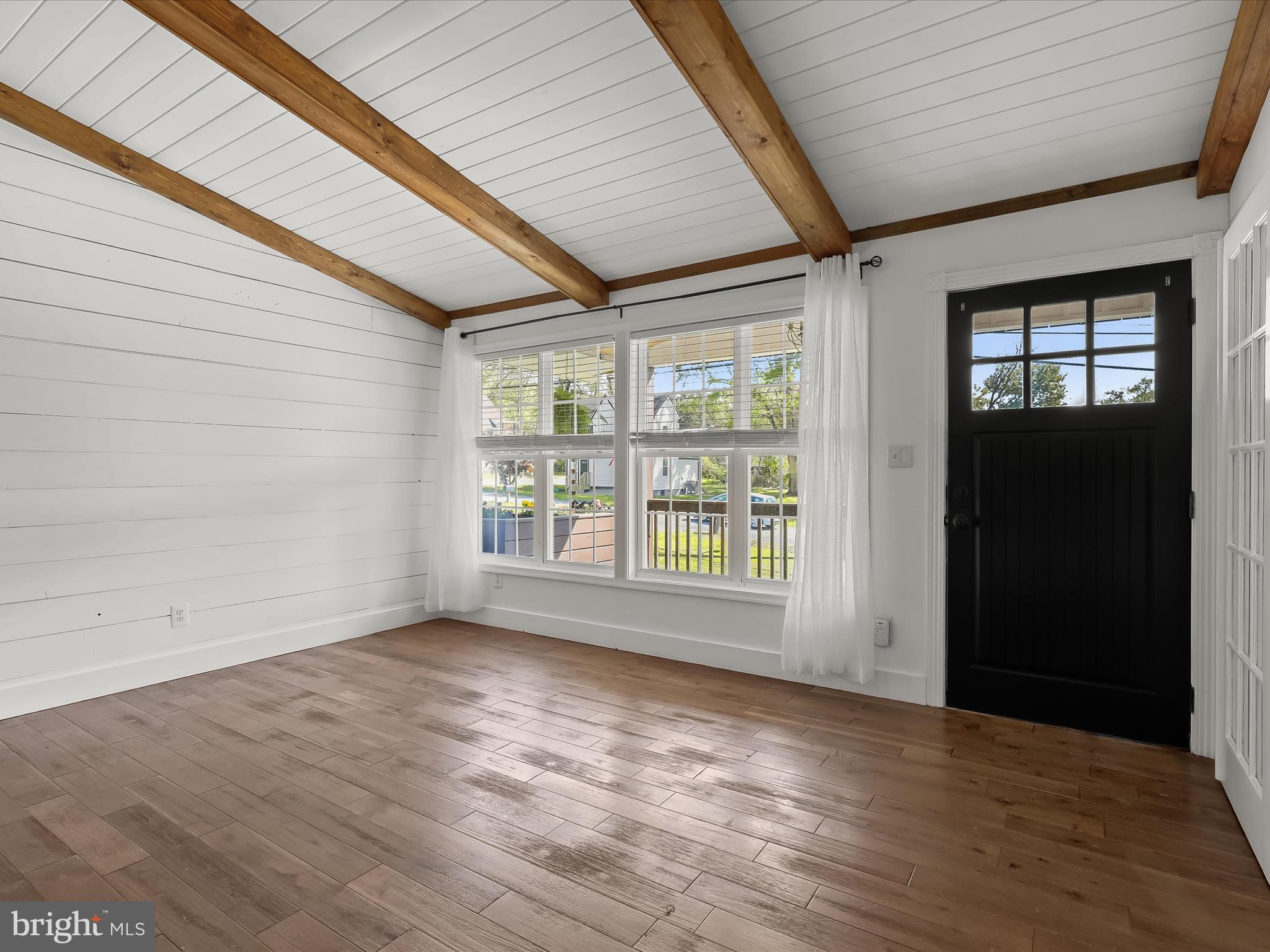1208 Joppa Road Joppa, MD 21085 - Photo 6 of 54 an empty room with wooden floor and windows