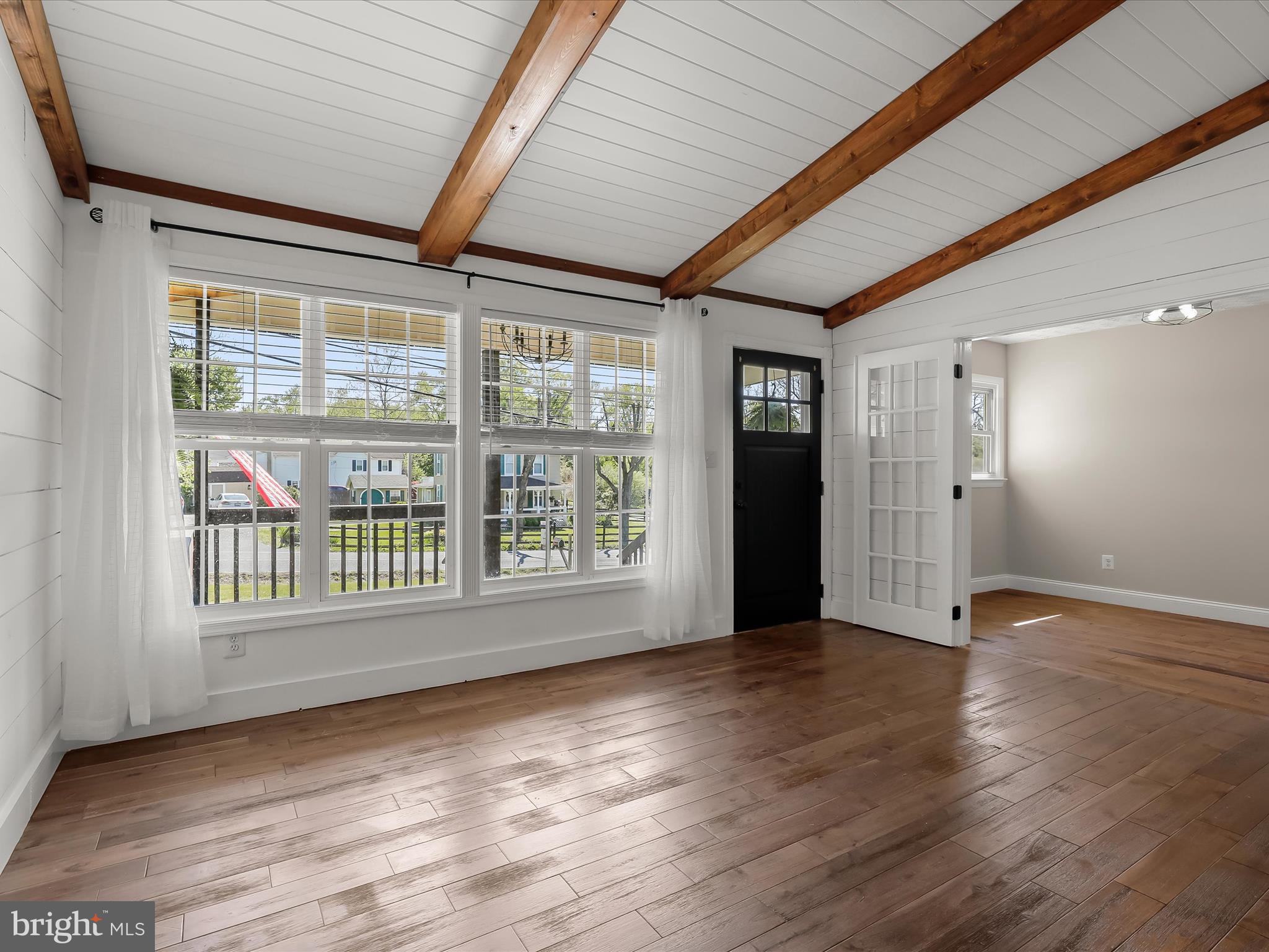 1208 Joppa Road Joppa, MD 21085 - Photo 7 of 54 an empty room with wooden floor and windows