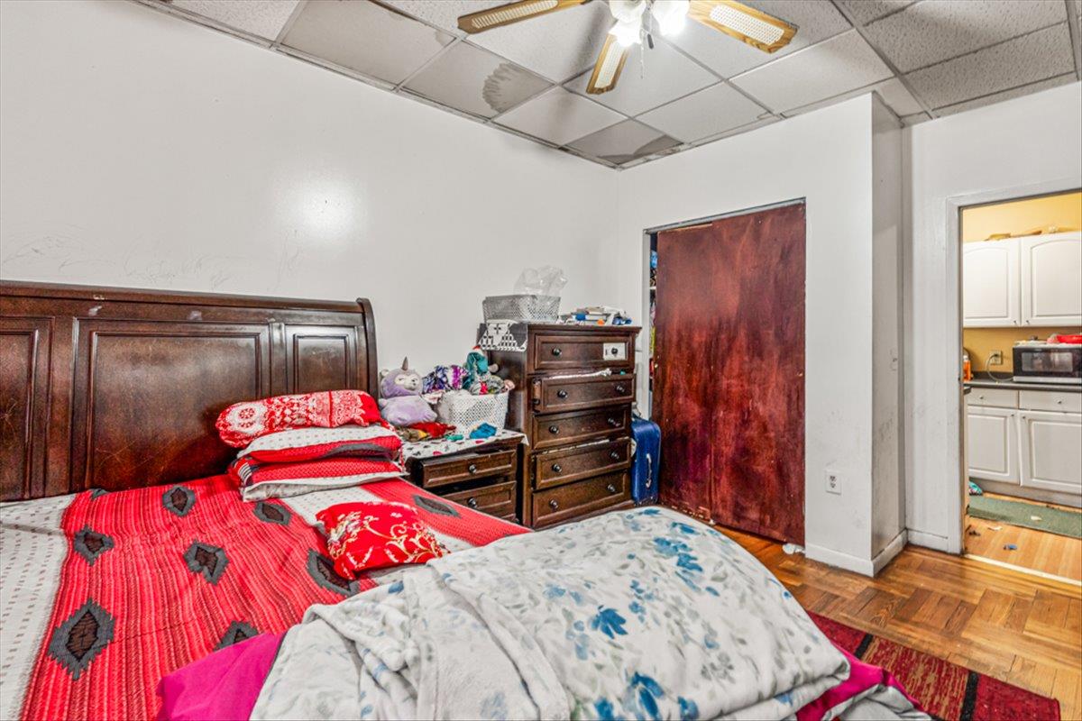 1715 St Peters Avenue Bronx, NY 10461 - Photo 13 of 30 a bedroom with a bed and a closet