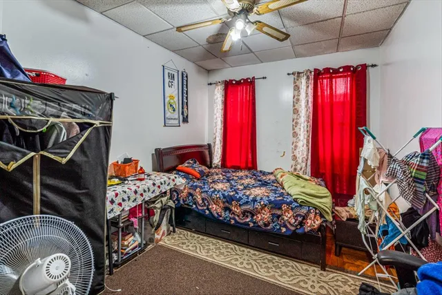 a bed room with a bed and a chandelier