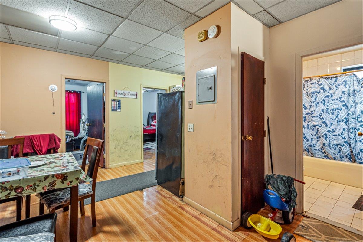 1715 St Peters Avenue Bronx, NY 10461 - Photo 18 of 30 a living room with furniture and a table