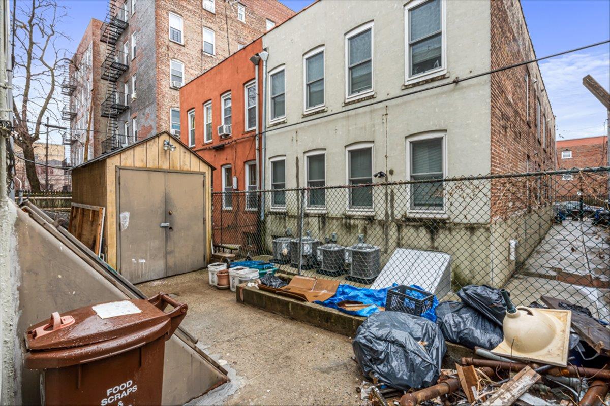 1715 St Peters Avenue Bronx, NY 10461 - Photo 30 of 30 a backyard of a house with outdoor seating