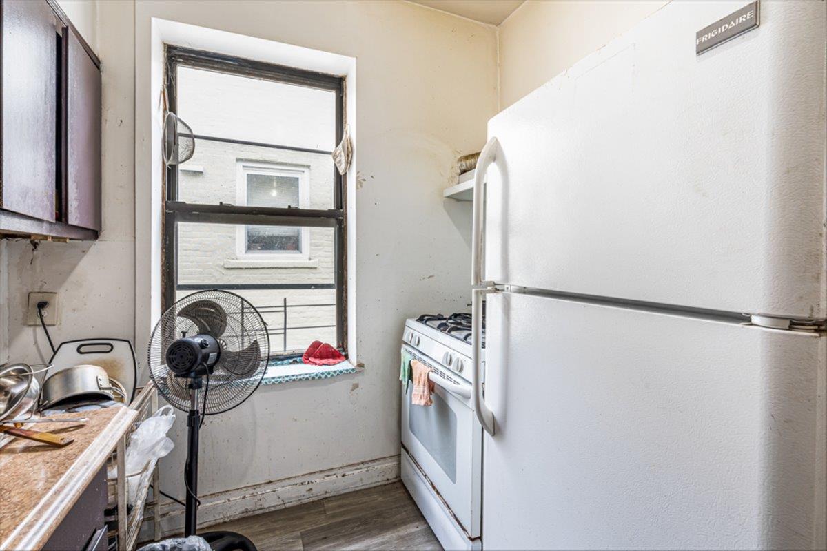 1715 St Peters Avenue Bronx, NY 10461 - Photo 4 of 30 a view of a storage and utility room with washer and dryer