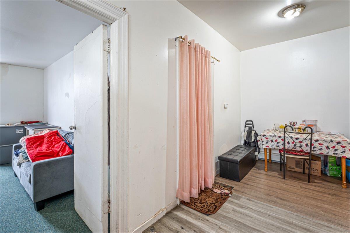 1715 St Peters Avenue Bronx, NY 10461 - Photo 5 of 30 a living room with furniture and a wooden floor