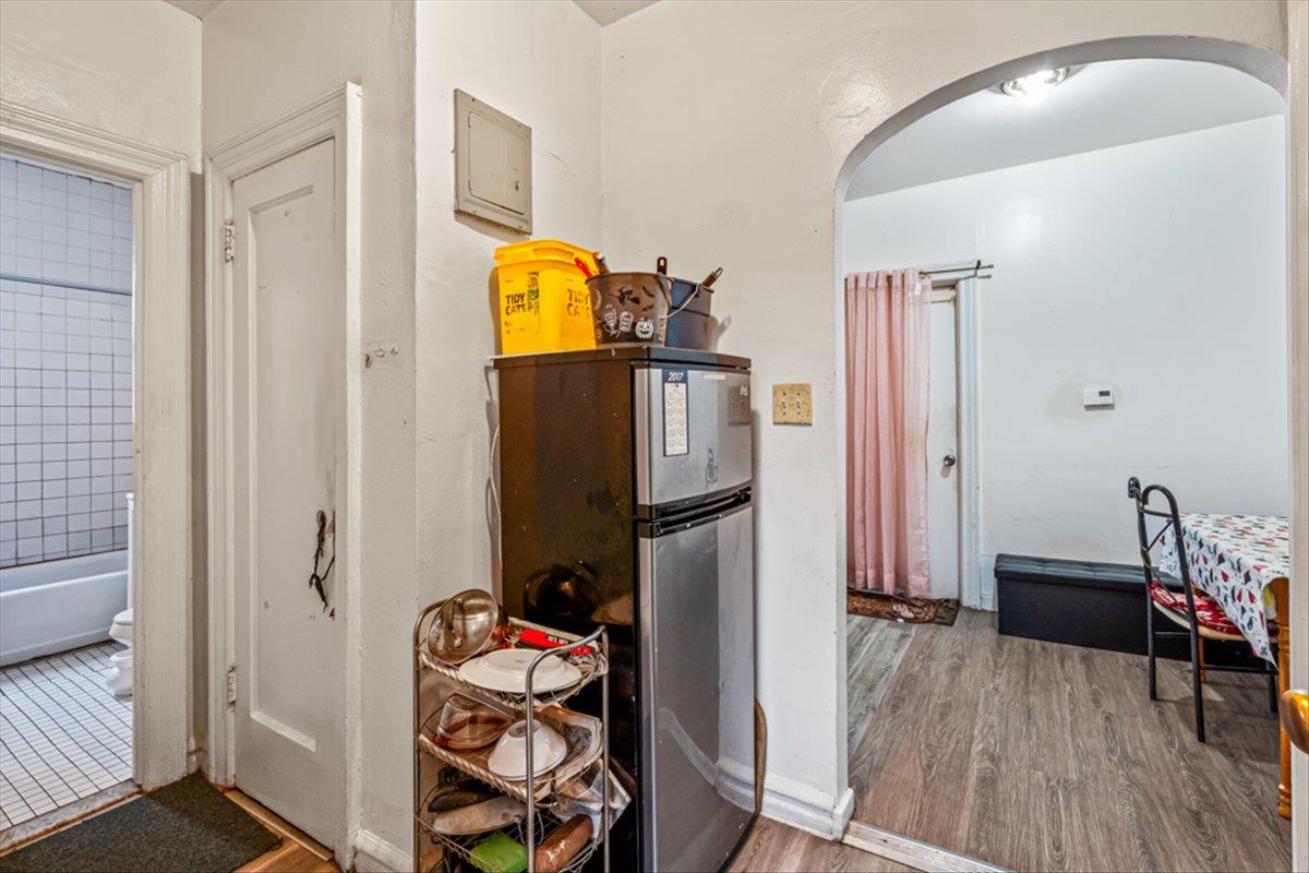 1715 St Peters Avenue Bronx, NY 10461 - Photo 7 of 30 a view of a bedroom with baby bed and workspace