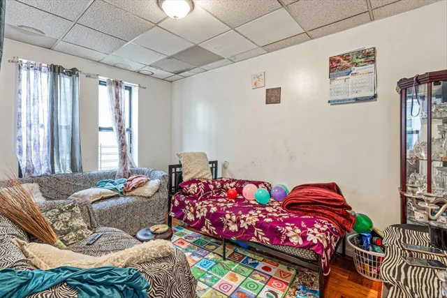 a bedroom with bed and a window