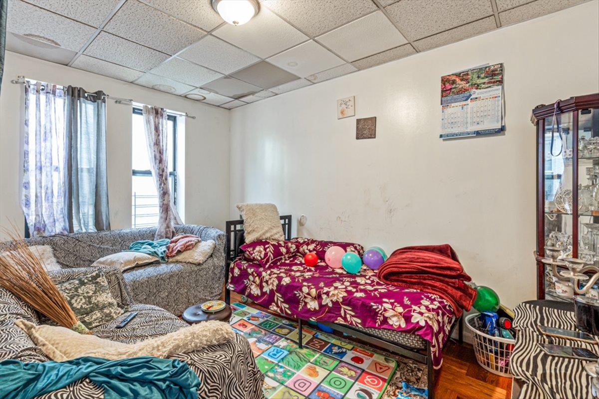 1715 St Peters Avenue Bronx, NY 10461 - Photo 10 of 30 a bedroom with bed and a window