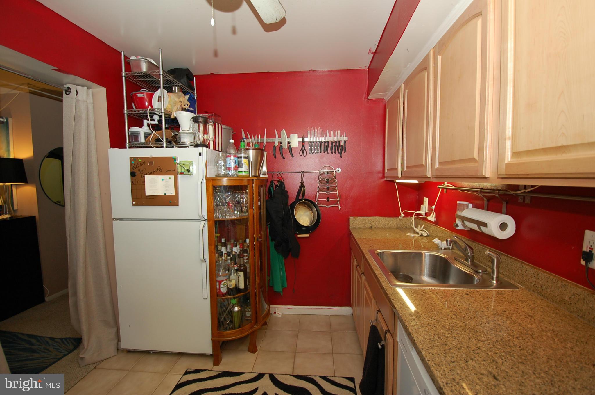 3932 Bel Pre Road, Unit 2 Silver Spring, MD 20906 - Photo 14 of 16 a kitchen with refrigerator and window