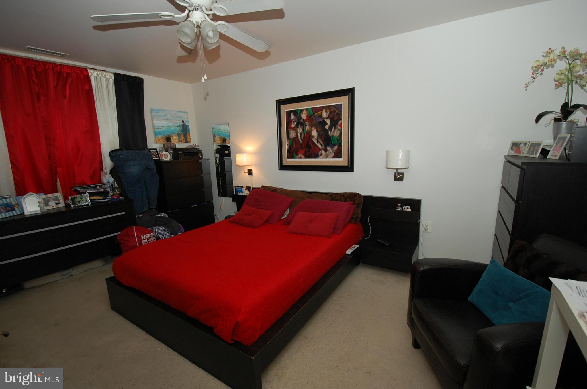 3932 Bel Pre Road, Unit 2 Silver Spring, MD 20906 - Photo 6 of 16 a bed room with a bed window and television