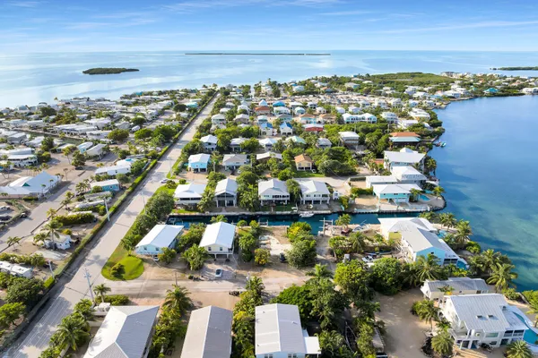 a road view with a building in the background