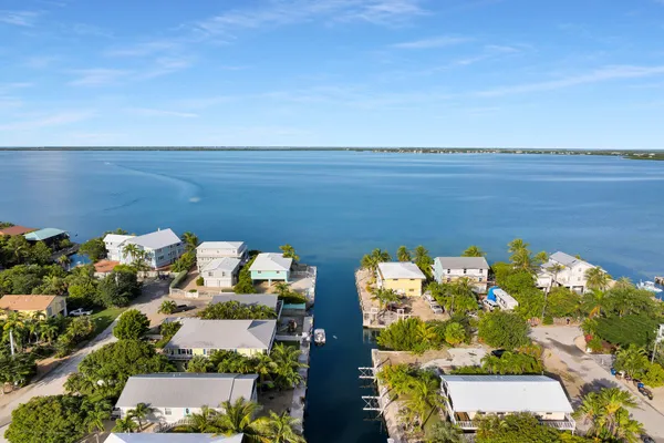 a view of a lake with a house in the background