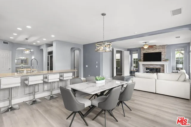 a dining room with furniture window wooden floor