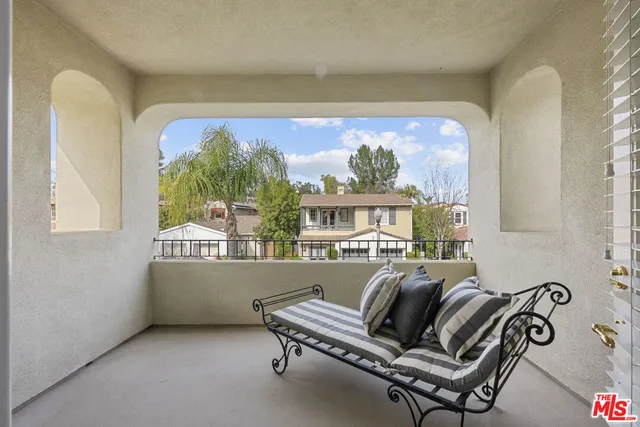 a workspace with furniture and a potted plant