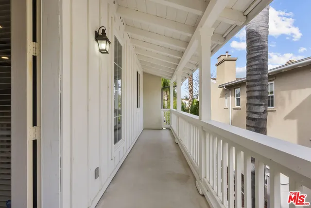 a view of a chairs and table in the back yard of the house