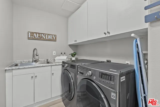 a bathroom with a toilet a sink and tub