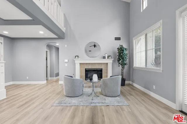 a living room with couch and a window